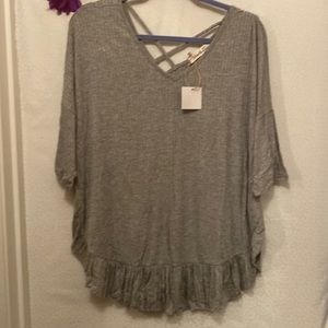 Lightweight summer blouse with crisscross design in back.